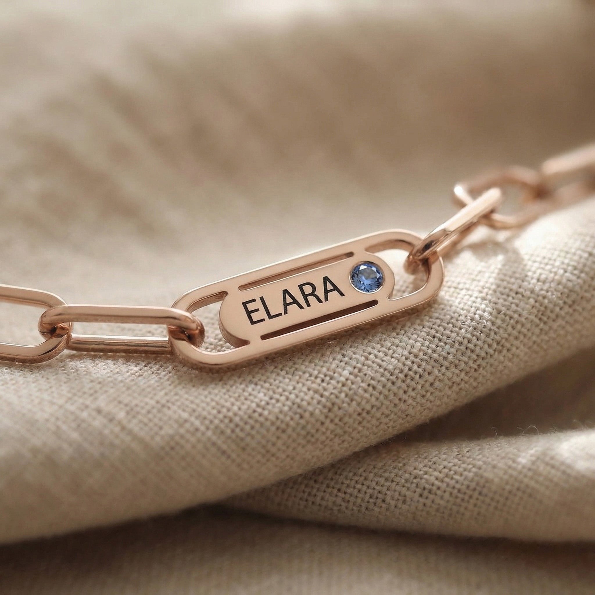 Close-up of Endless Ties Necklace showing engraved name on link with fine detail and polished finish