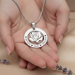 Personalizedrose family necklace with engraved family names held in hand, belle fever custom family pendant gift.