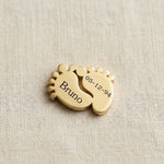Gold baby feet charm for Dream Locket bracelet symbolizing motherhood, newborn memories, and family love