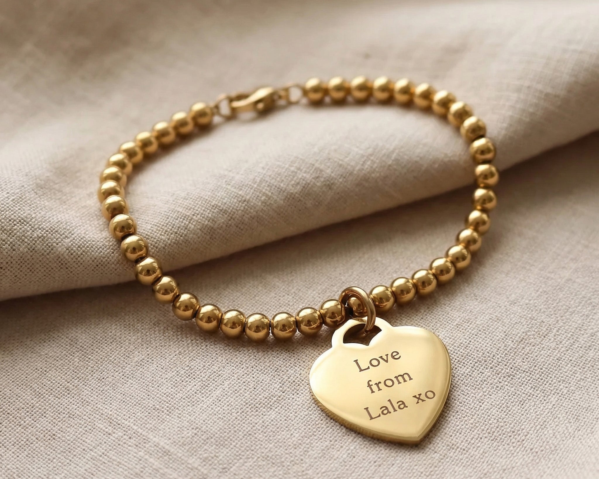 Forever In My Heart Charm Bracelet in gold with engraved heart charm, personalised jewellery hero image