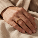 Woman wearing golden link ring, stylish chain ring design for everyday jewellery look