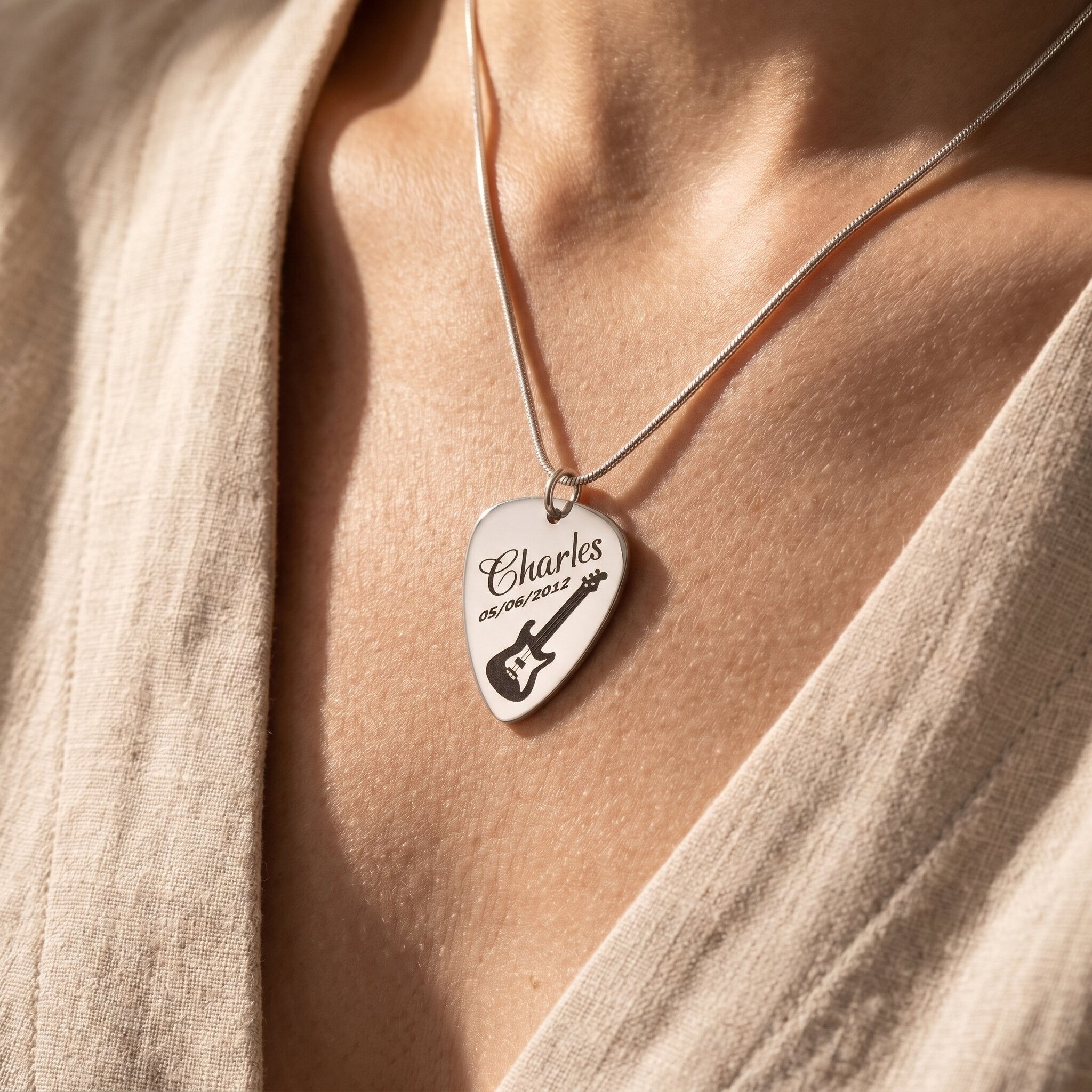 Woman wearing guitar pick necklace with engraved name, personalised music jewellery style