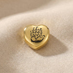Gold heart charm with hand illustration for Moments Bracelet symbolizing love, loyalty, and connection