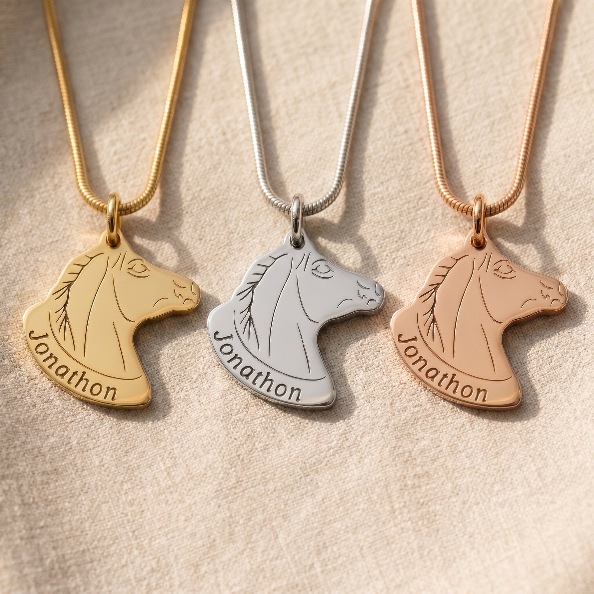 Horse head name necklace tone comparison showing gold, silver and rose gold finishes