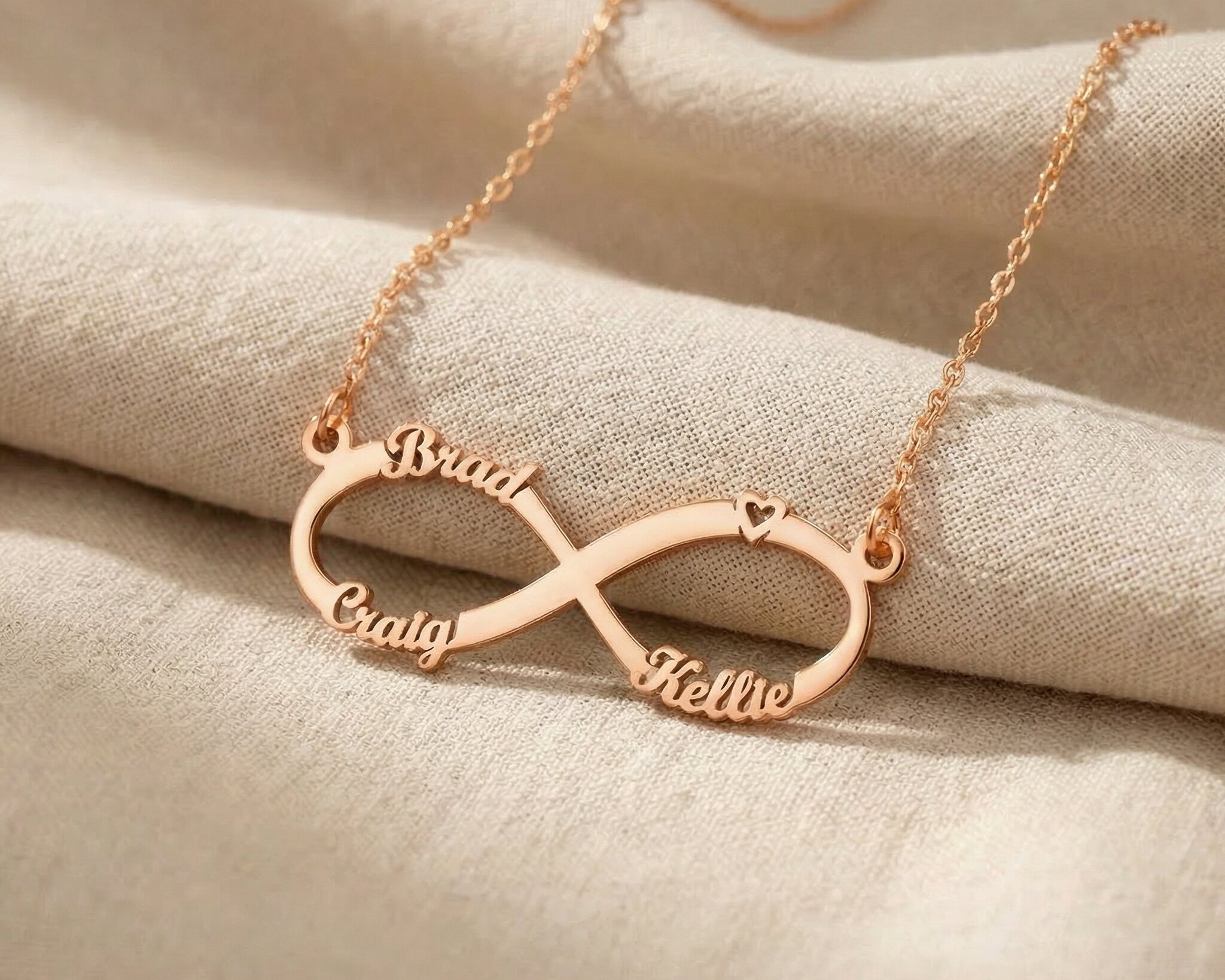 Rose gold infinity name necklace with custom name on infinity pendant design