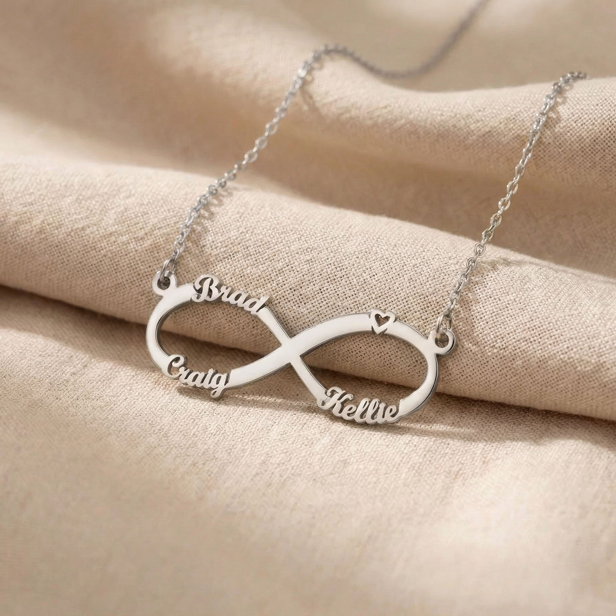 Silver infinity name necklace with custom name on infinity pendant design