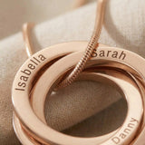 Close-up of Interlinked Love Ring Necklace showing engraved detail on interlocking rings