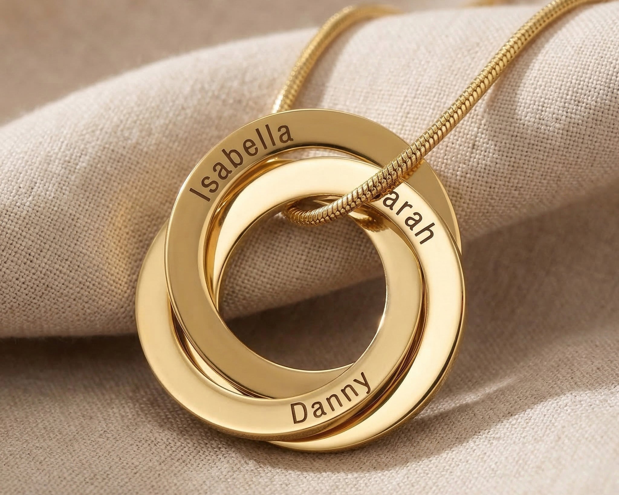 Interlinked Love Ring Necklace in gold with interlocking rings, personalised jewellery hero image
