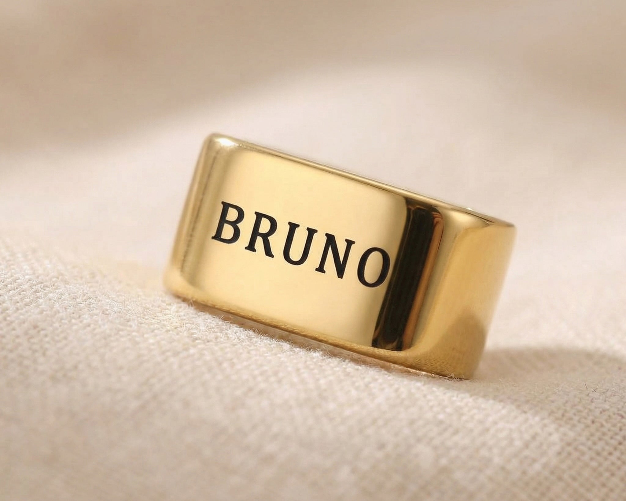 Gold Leather Bracelet Charms with name engraved displayed on neutral background