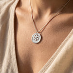 Woman wearing let it go necklace, meaningful jewellery symbolising healing, self-growth and emotional strength