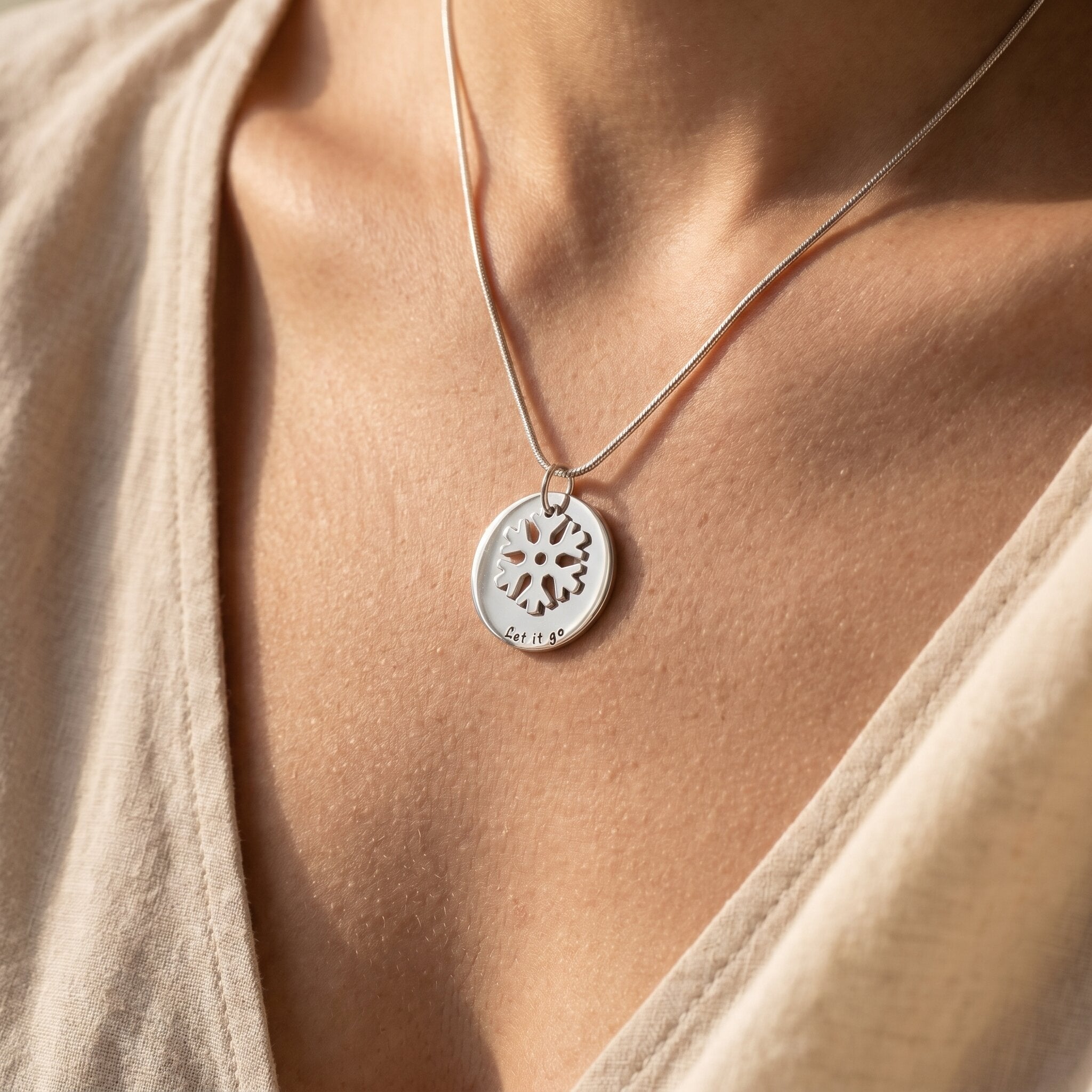 Woman wearing let it go necklace, meaningful jewellery symbolising healing, self-growth and emotional strength