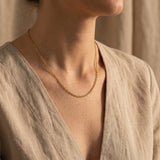 Woman wearing link chain necklace, minimalist chain jewellery for layering and modern everyday styling