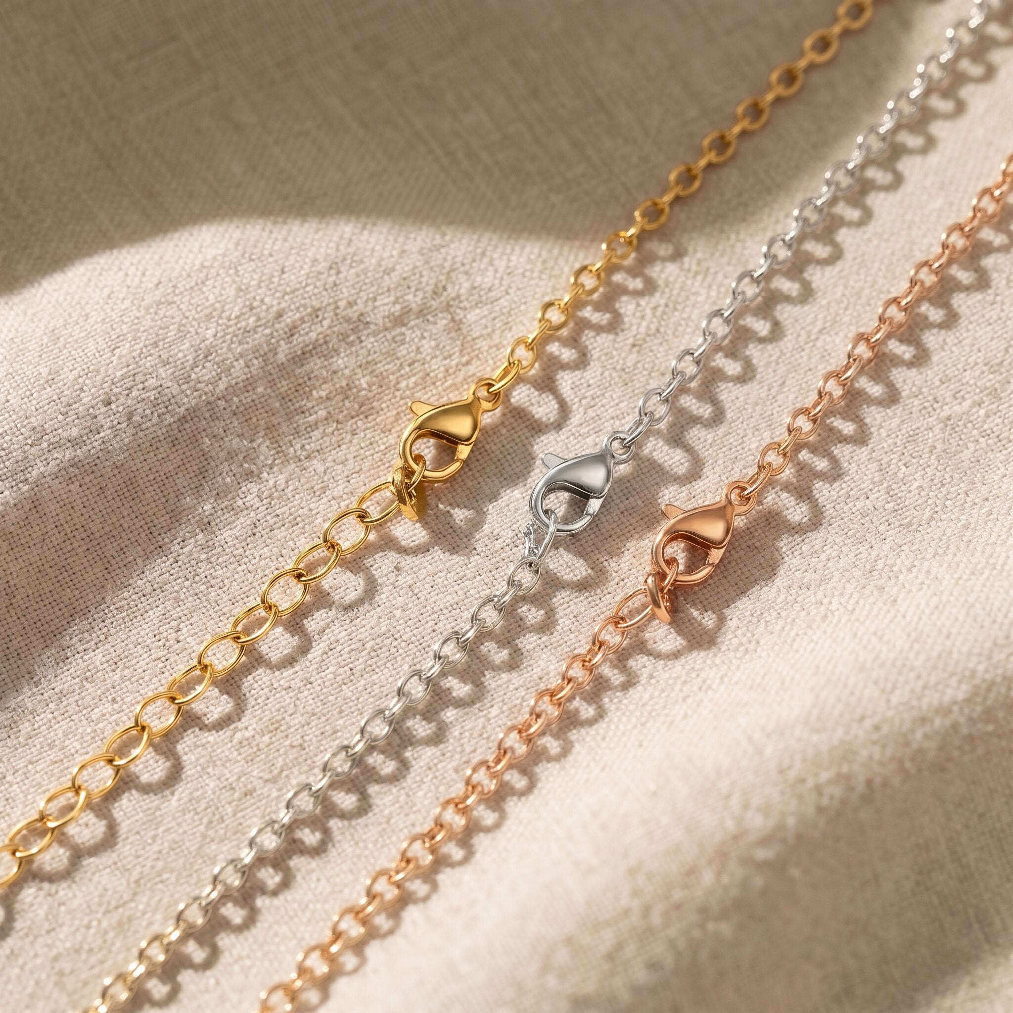 Link chain necklace tone comparison showing gold, silver and rose gold minimalist chain jewellery finishes