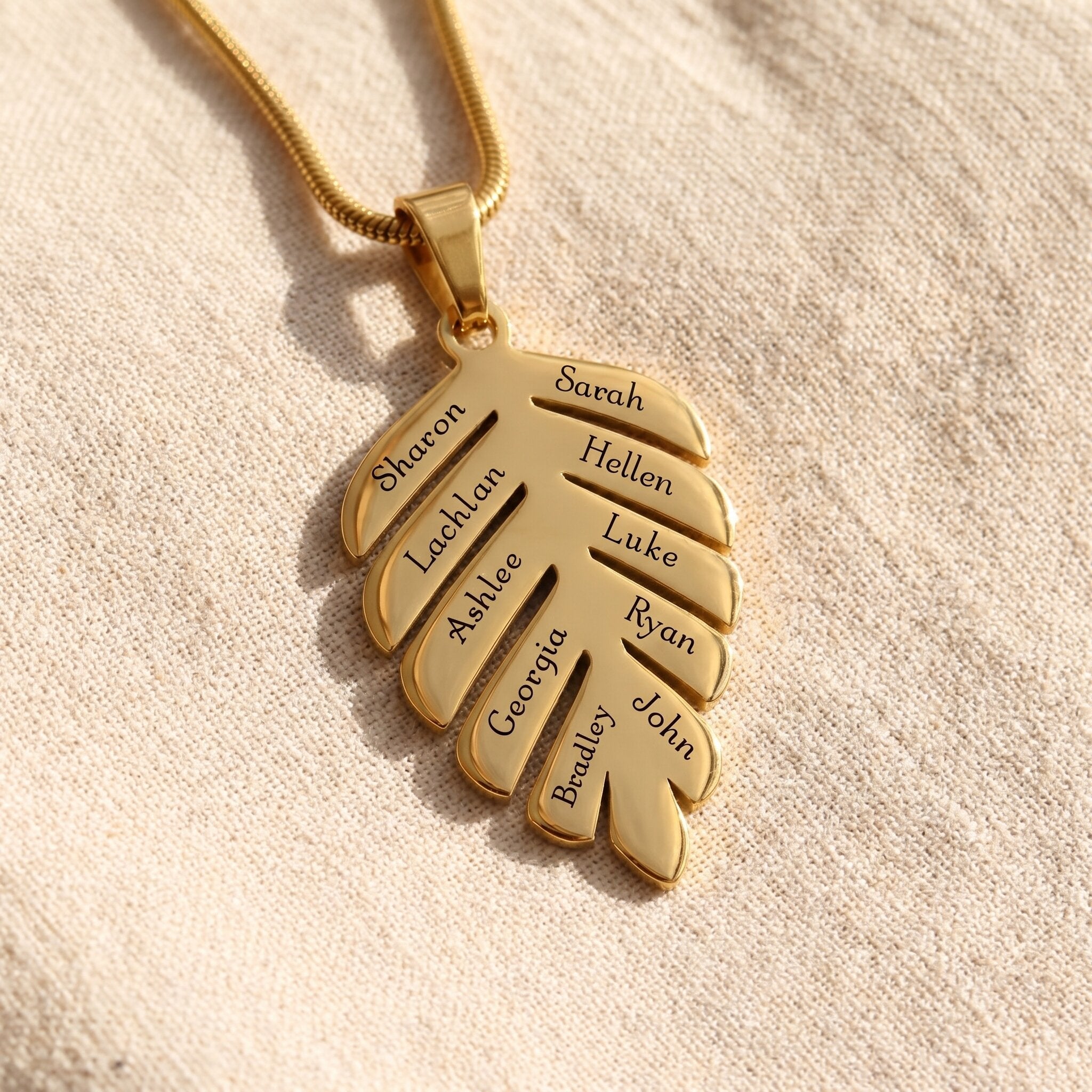 Family leaf necklace in gold medium size with engraved names, personalised family keepsake jewellery gift