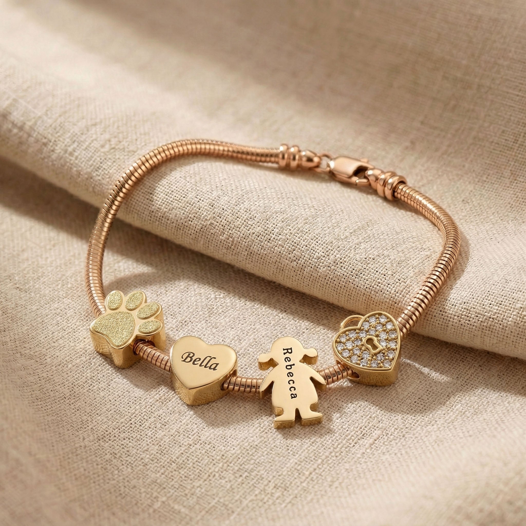 Moments charm bracelet option showing personalised charms including heart and family symbols
