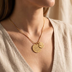 Woman wearing mother forever necklace, layered family keepsake jewellery with engraved disc and heart charms