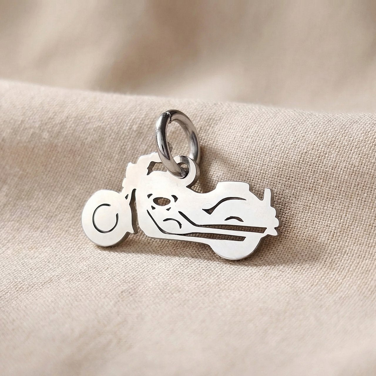 Silver motorbike charm for keyring symbolizing freedom, adventure, and passion for motorcycle journeys