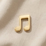 Gold music note charm for Dream Locket bracelet symbolizing passion for music, creativity, and meaningful memories