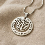Silver My Family Tree necklace with circular pendant featuring tree of life design