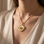 Woman wearing personalised spinning necklace, meaningful hidden message jewellery gift for her