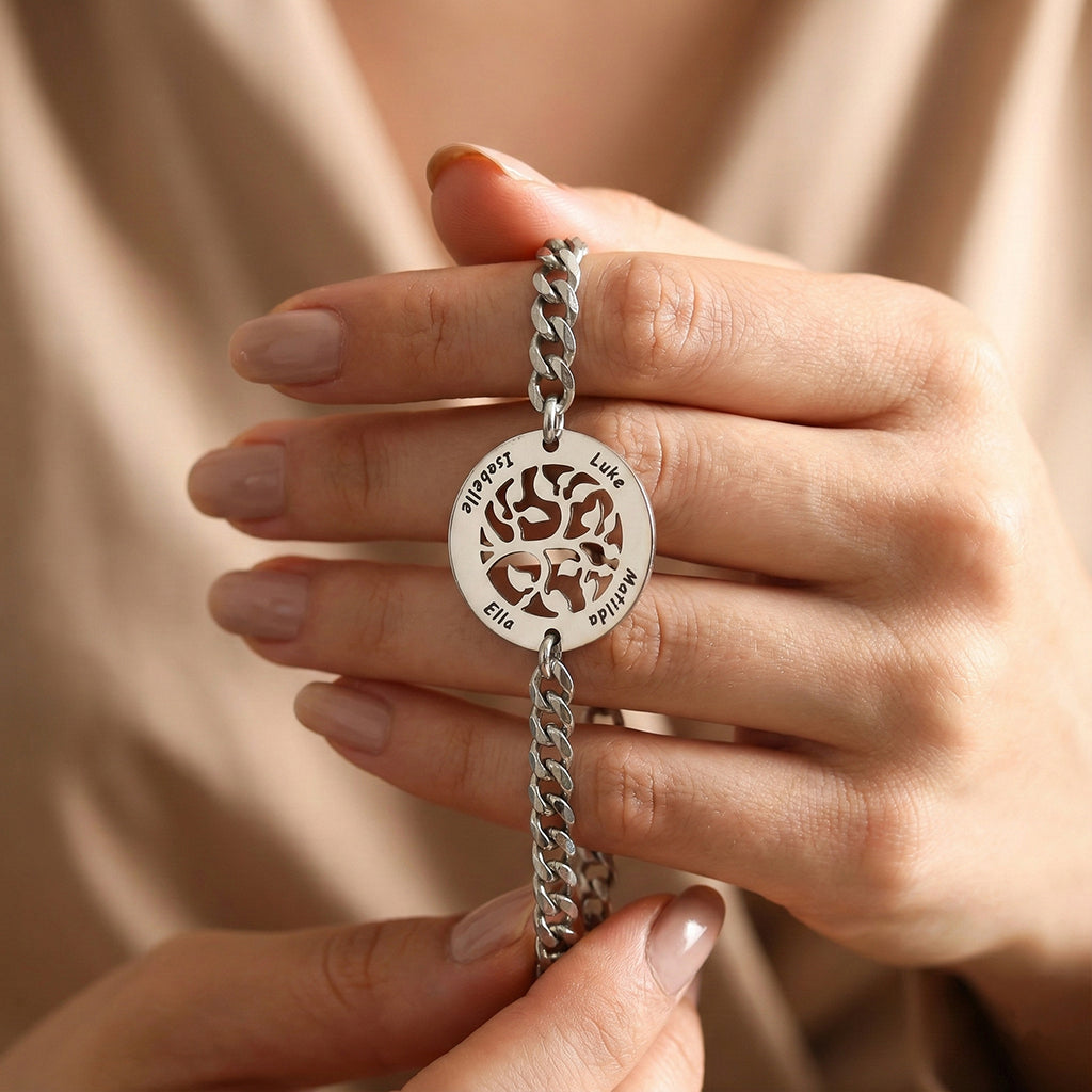 Belle Fever family tree bracelet close-up, custom engraved tree of life pendant bracelet, personalised family name jewellery, sentimental gold keepsake gift for her.