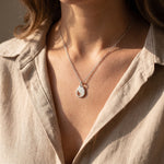 Woman wearing persistence necklace, elegant jewellery representing resilience and inner strength