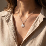 Woman wearing persistence necklace, elegant jewellery representing resilience and inner strength