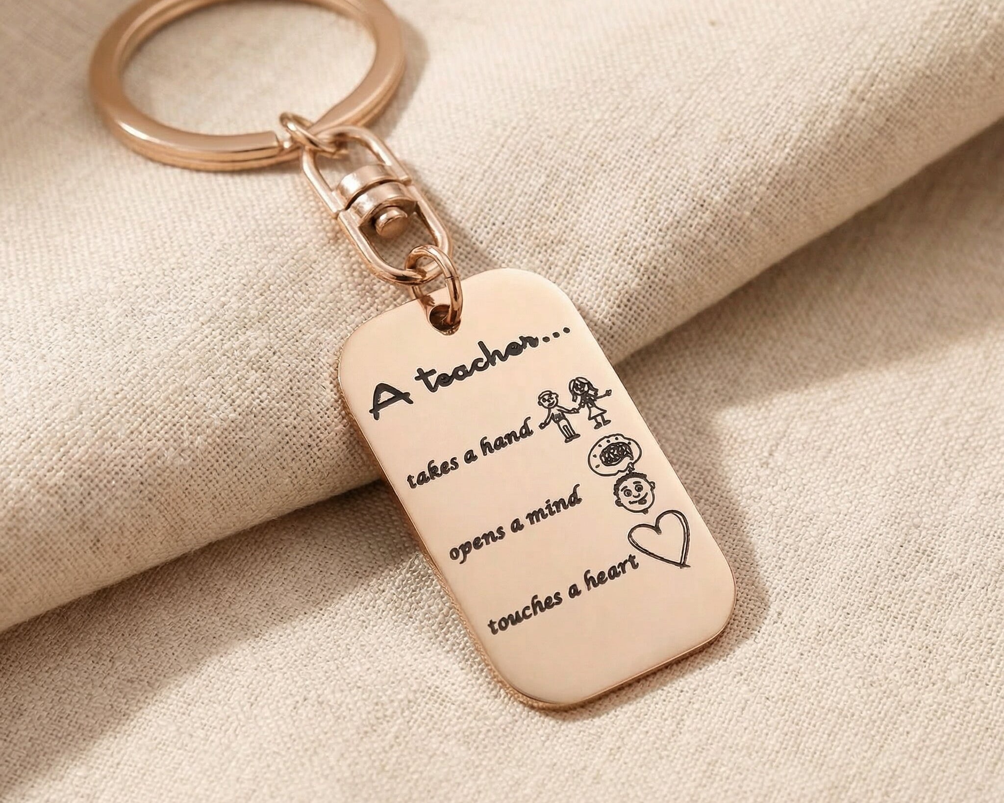 Personalised dog tag keyring in rose gold with engraved message, elegant keepsake design