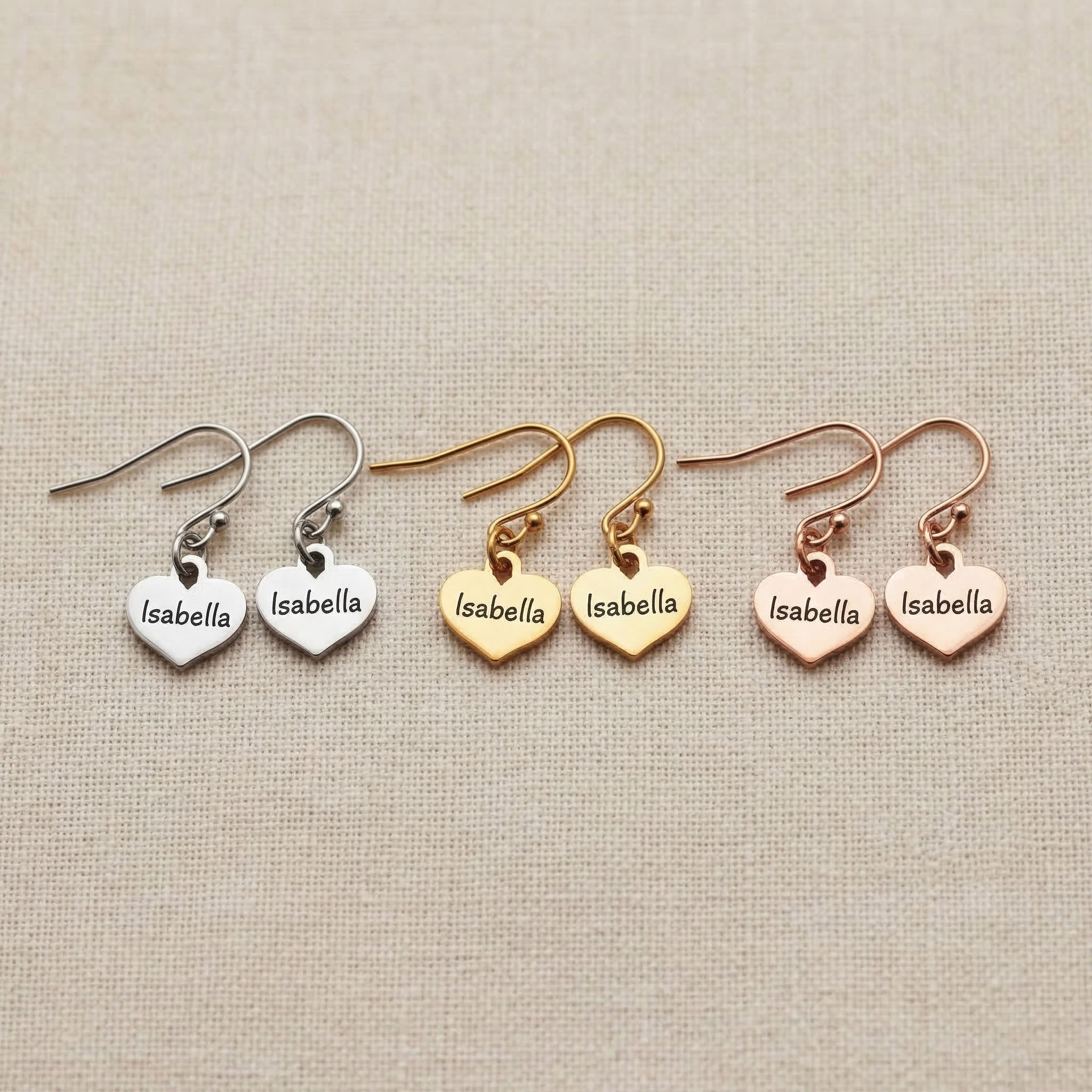 Personalised earrings showing heart shape options with engraved name customization