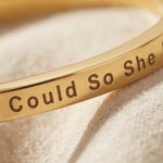 Close-up of personalised inspirational bangle with engraved message detail