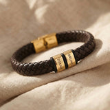 Personalised leather bracelet with gold engraved name charms, bold custom jewellery design