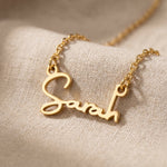 Personalized signature font name necklace in elegant gold script design with custom handwritten jewelry styling