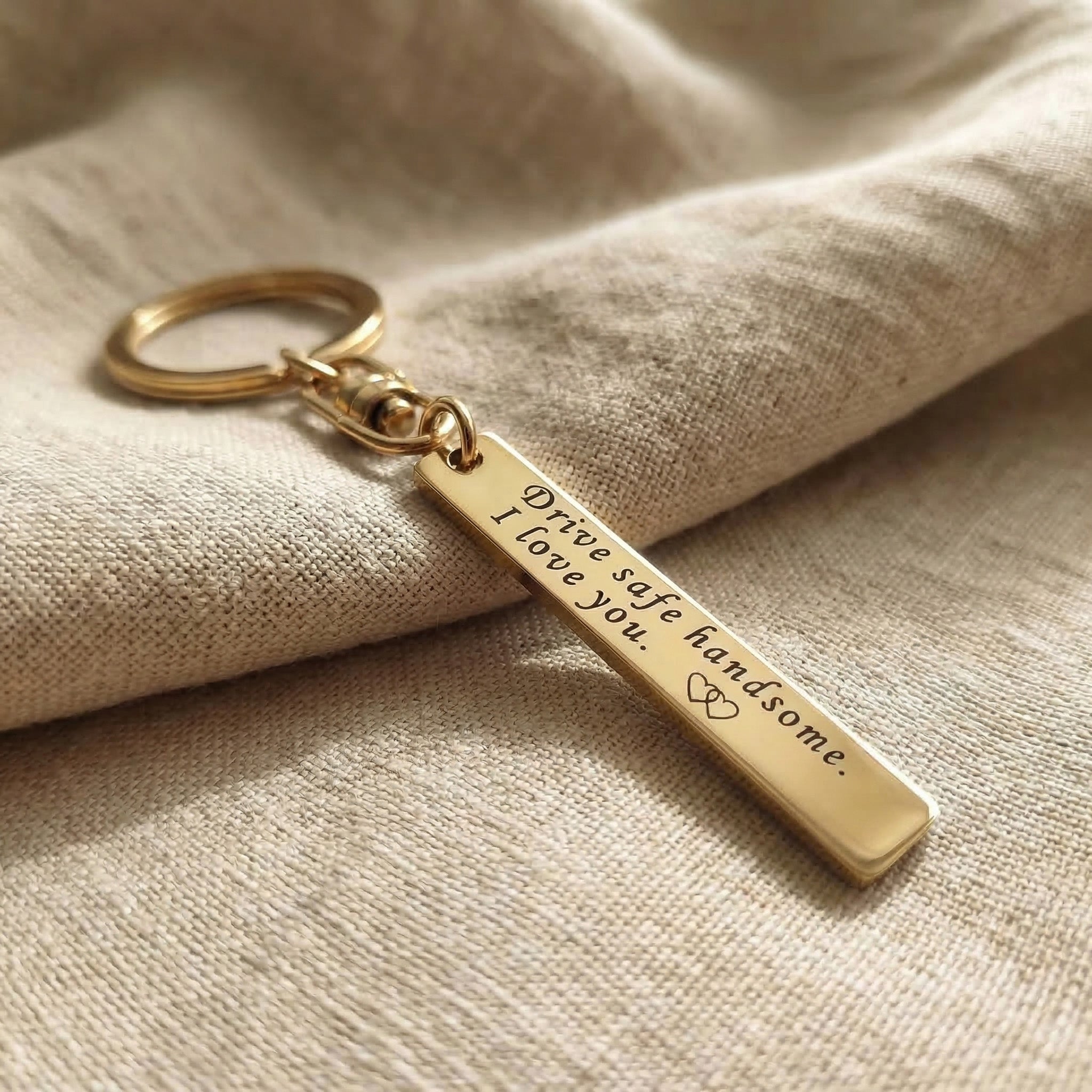 Personalised tag keyring in gold with engraved message, minimal keepsake design
