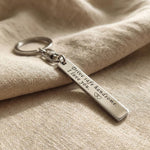 Personalised tag keyring in silver with engraved message, classic minimalist style