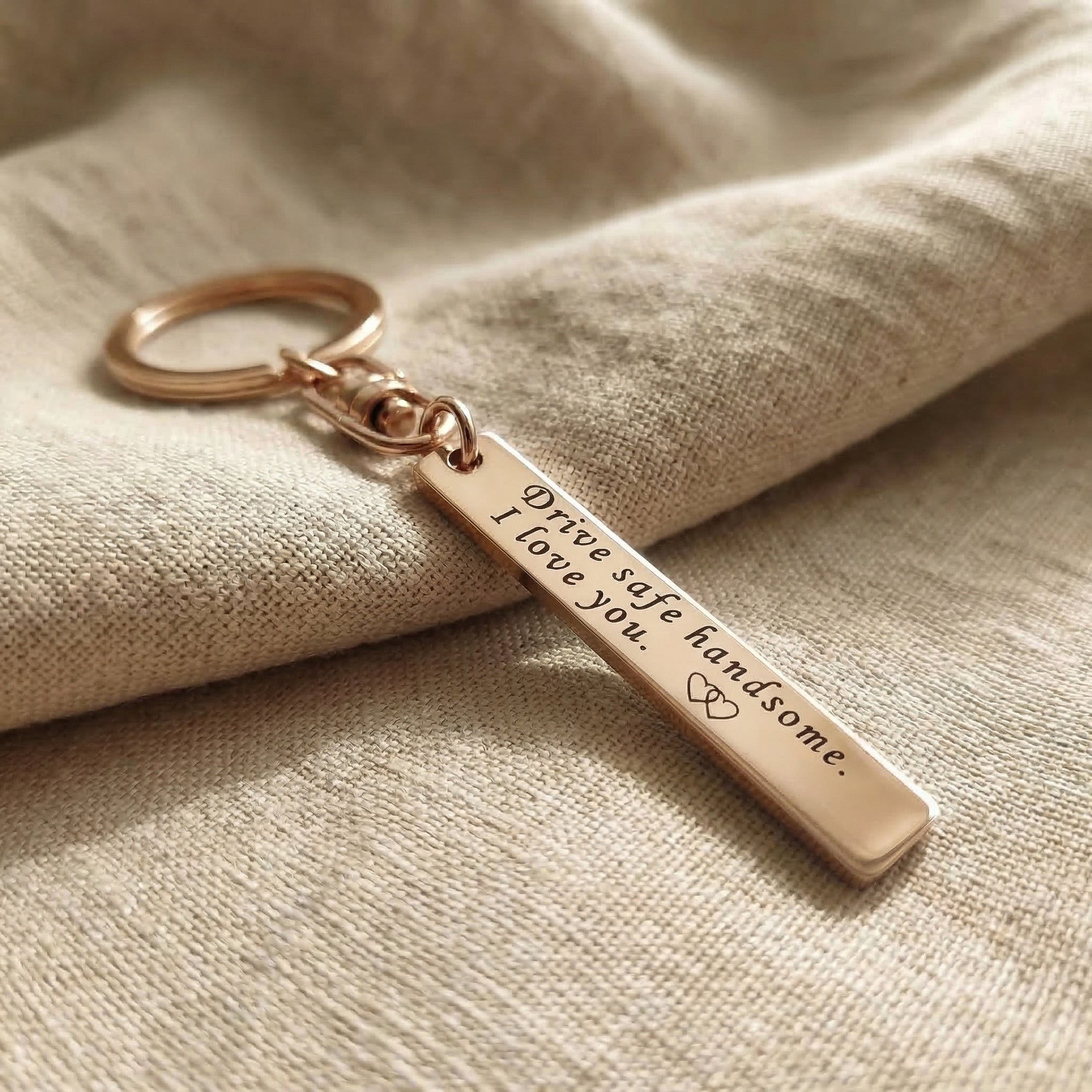 Personalised tag keyring in rose gold with engraved message, elegant gift design