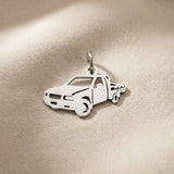 Silver pickup truck charm for keyring symbolizing adventure, road trips, and hardworking lifestyle memories