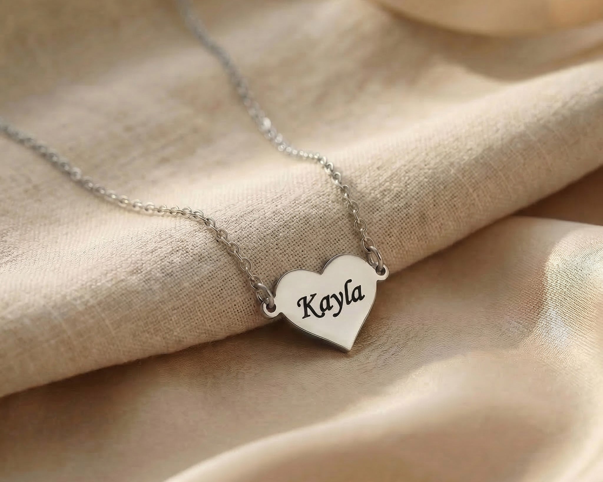 Personalised heart necklace in silver with engraved name, classic minimal design