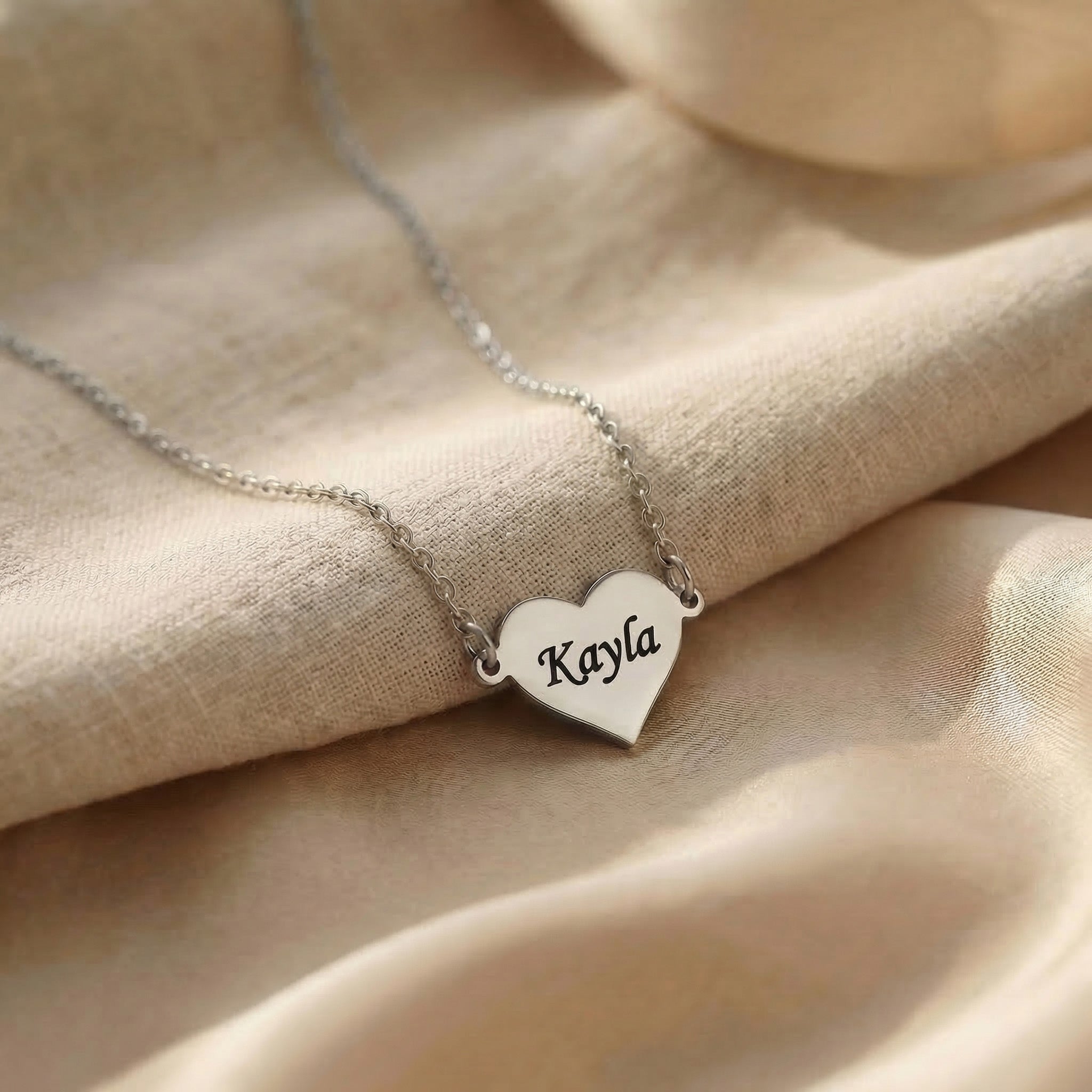 Personalised heart necklace in silver with engraved name, classic minimal design