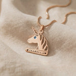 Video showing unicorn head name necklace with engraved name and birthstone detail