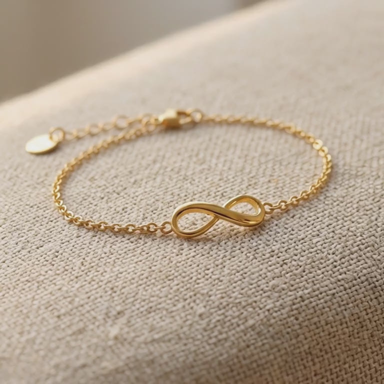 Product video showing infinity bracelet or anklet with delicate chain and infinity symbol design