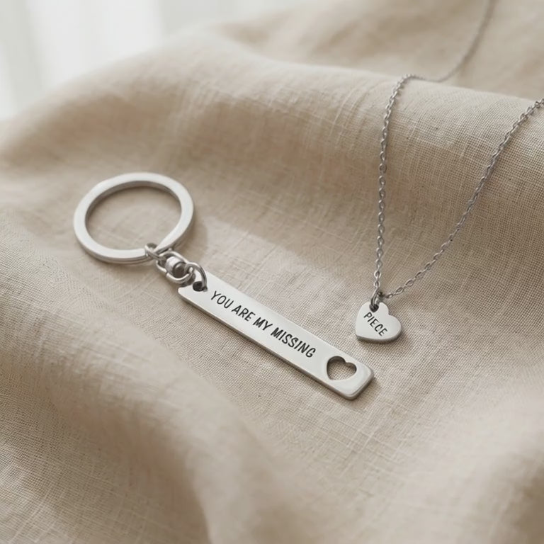 Video showing missing piece necklace and keyring set with engraved detail and matching design
