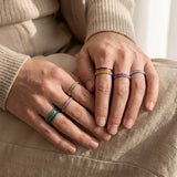 Hands wearing river ring stackable gemstone rings, stylish layered jewellery for modern everyday styling