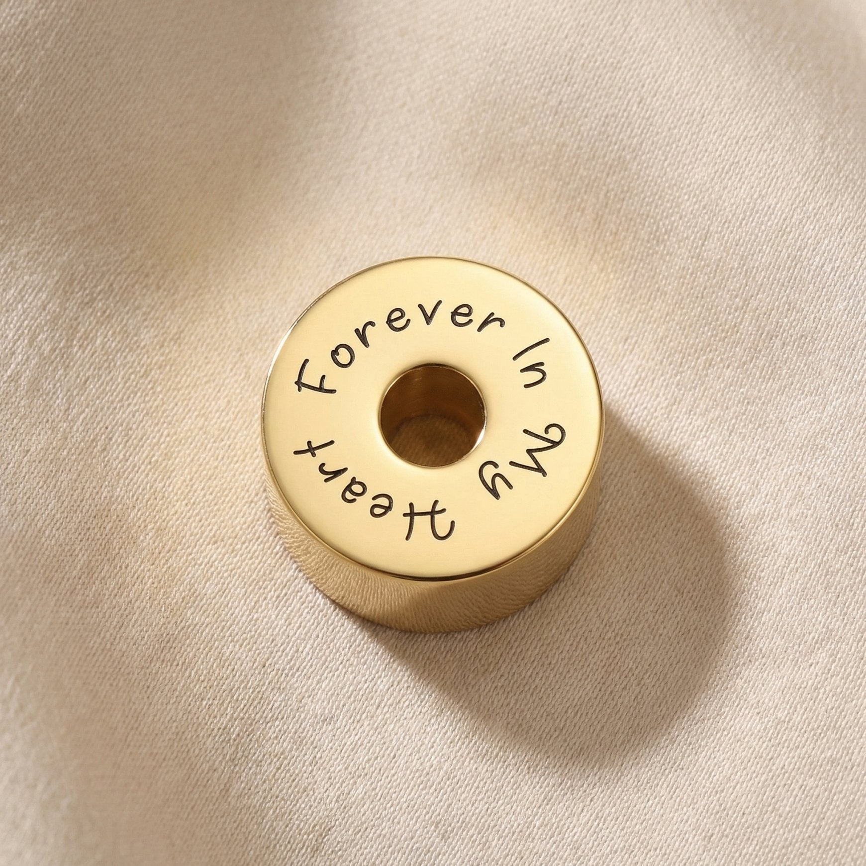 Round cremation charm for Moments Bracelet designed to hold ashes as a sentimental memorial keepsake
