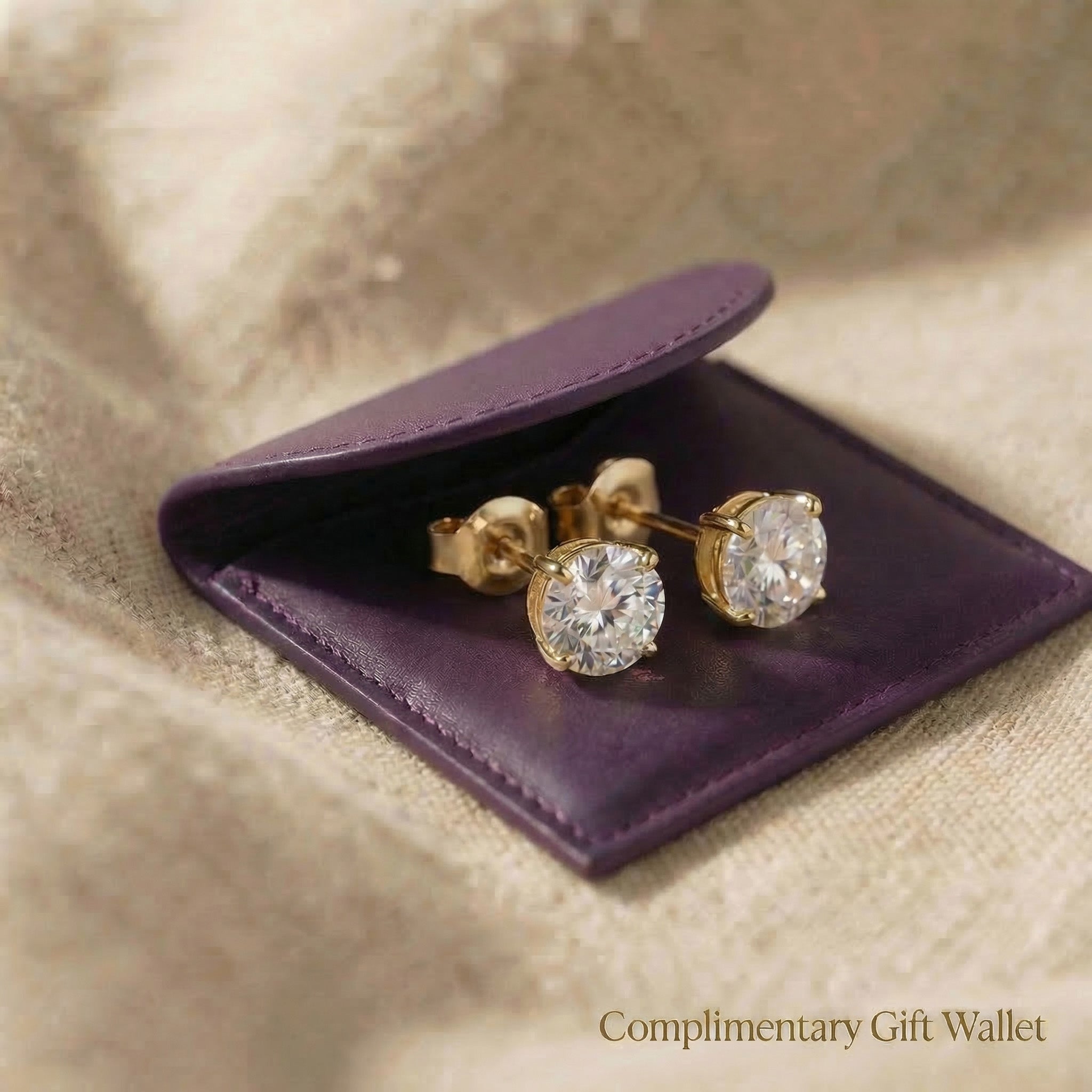 Round stud earrings displayed with gift wallet packaging, elegant jewellery gift option