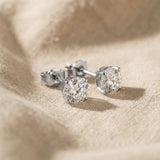 Round stud earrings in silver with sparkling stone, timeless minimalist design