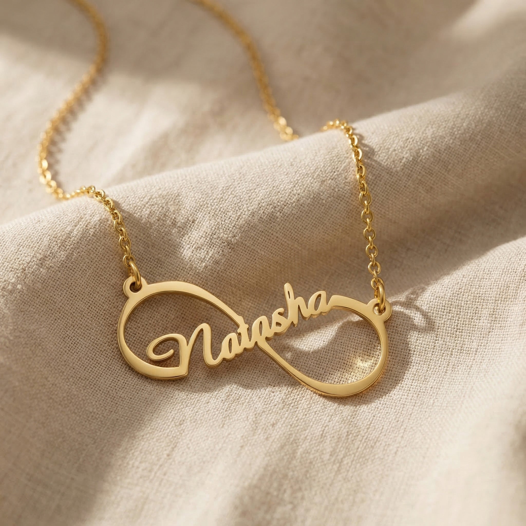 Single infinity name necklace in gold with personalised name, elegant everyday jewellery