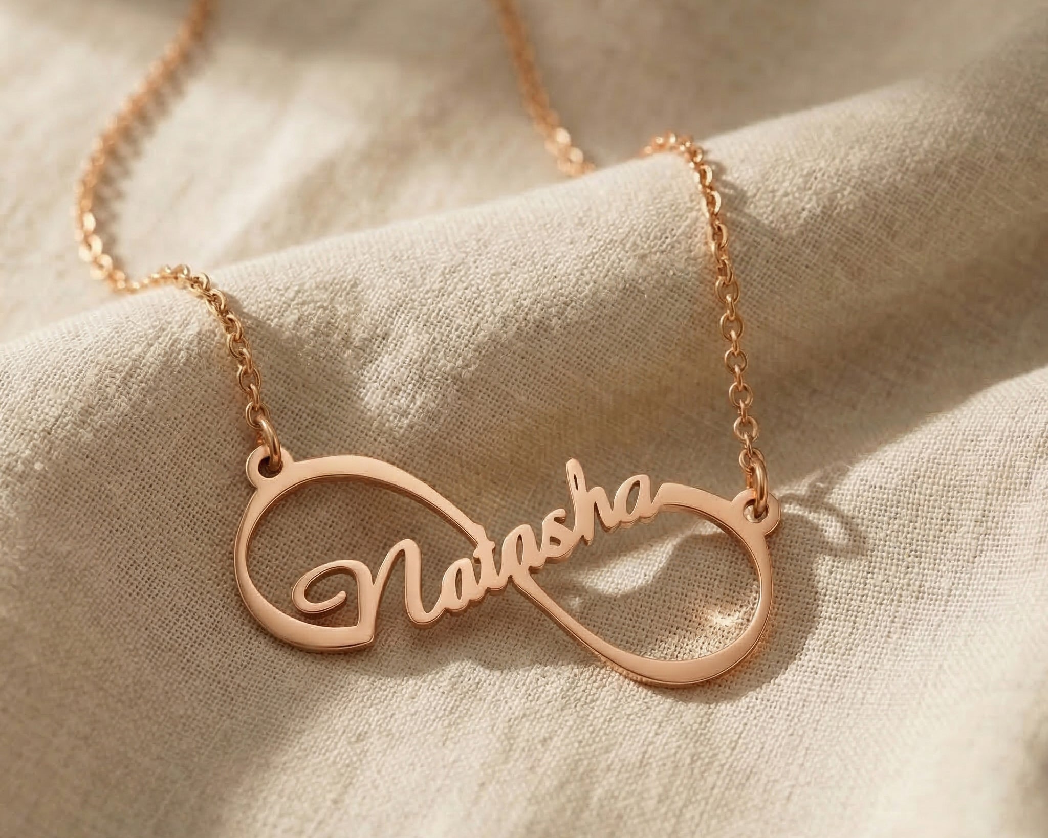 Single infinity name necklace in rose gold with personalised name detaill