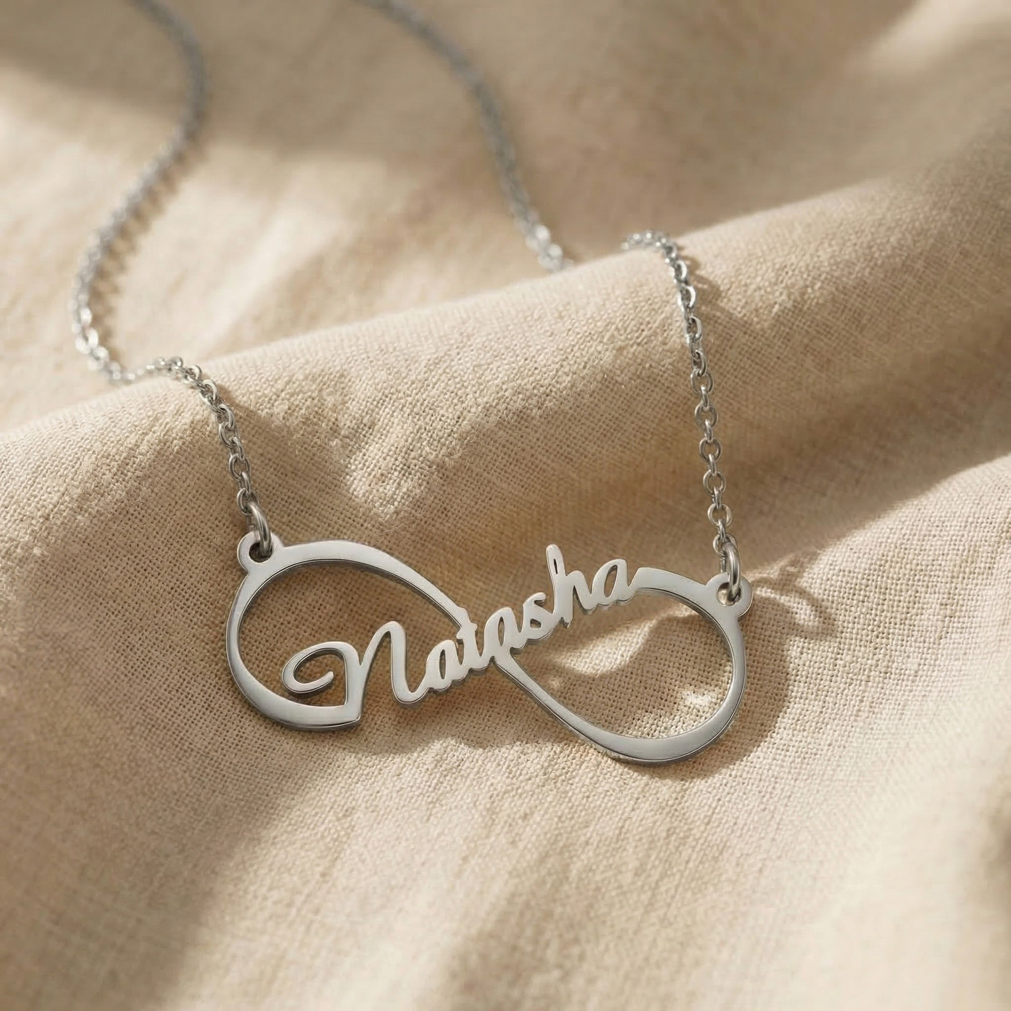 Single infinity name necklace in silver with personalised name, elegant minimal design