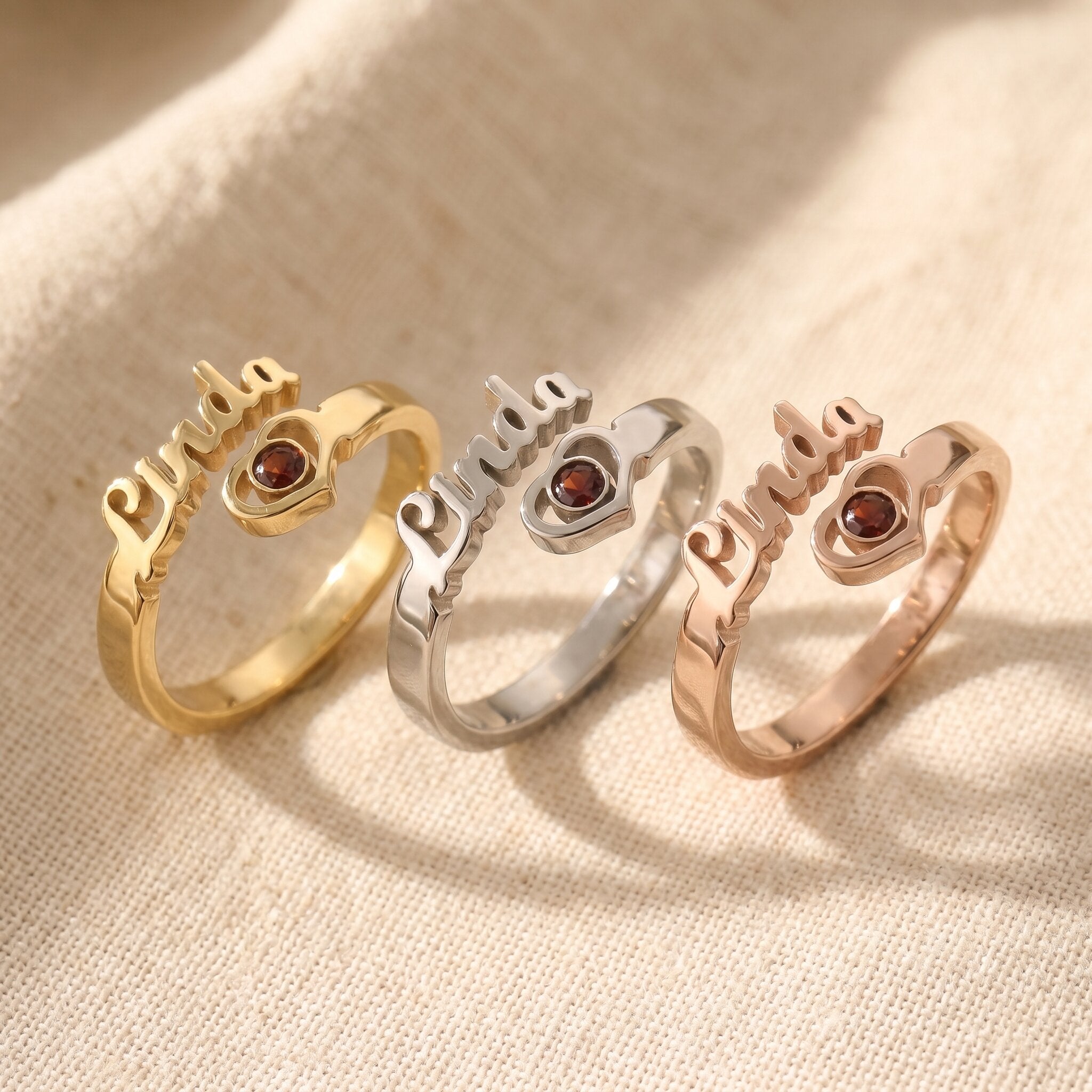 Single name ring tone comparison showing gold, silver and rose gold finishes