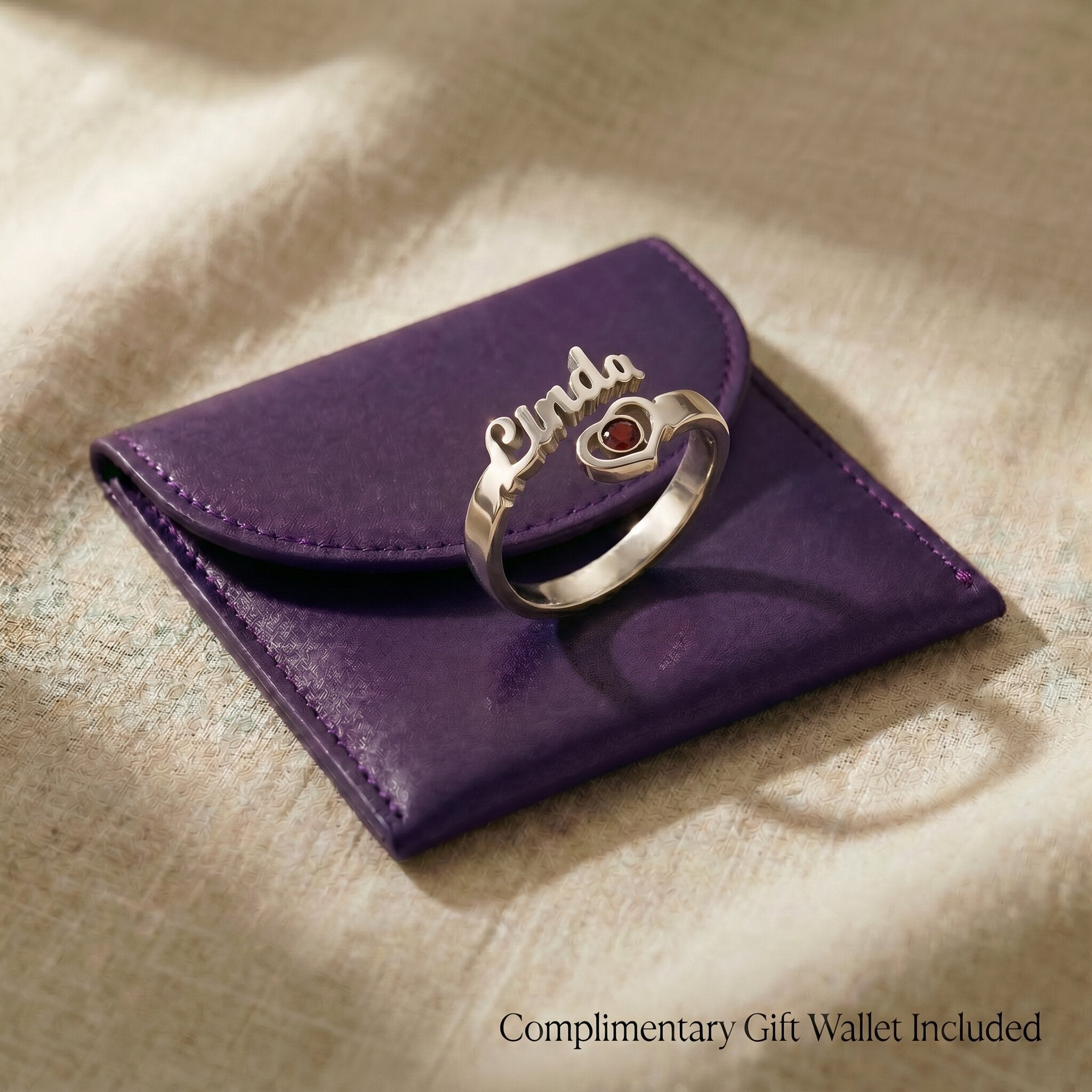 wallet.png
Personalized single name ring displayed with premium gift wallet packaging and minimalist jewelry styling